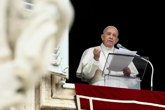 Pope Francis speaks from the window of the apostolic palace overlooking St. Peter's square in the Vatican during the weekly Angelus prayer on June 06, 2021.  VINCENZO PINTO / AFP