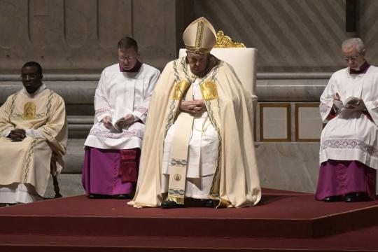 Pope Francis presides the Easter vigil as part of the Holy Week celebrations, at St Peter's Basilica in the Vatican on March 30, 2024. Tiziana FABI / AFP