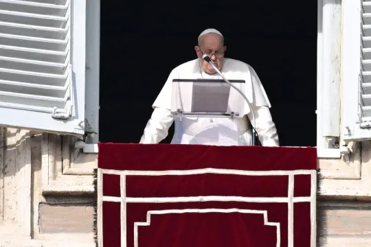 Pope Francis addresses the crowd from the window of the apostolic palace overlooking St. Peter's square during the Angelus prayer on January 14, 2024 in The Vatican. Tiziana FABI / AFP