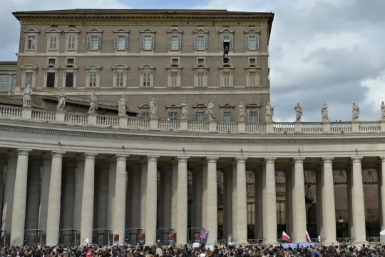 Pope Francis (C-UP) waves to the crowd, from the window of the Apostolic Palace overlooking St. Peter's Square, during the weekly Angelus prayer in The Vatican on March 3, 2024. Andreas SOLARO / AFP
