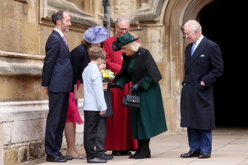 Britain's King Charles III (R) and Britain's Queen Camilla greet well-wishers as they leave St. George's Chapel, in Windsor Castle, after attending the Easter Mattins Service, on March 31, 2024. Hollie Adams / POOL / AFP