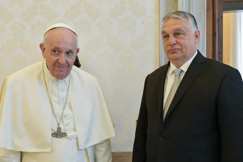 This photo taken and handout on April 21, 2022 by The Vatican Media shows Pope Francis and Hungary's Prime Minister Viktor Orban pose upon Orban's arrival for a private audience 