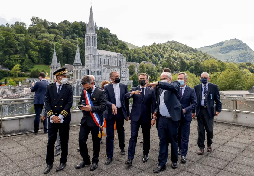 French President Emmanuel Macron arrives for a visit at the Catholic sanctuary of Notre Dame de Lourdes, southwestern France, on July 16, 2021. Macron is on a two-day visit in southwestern France