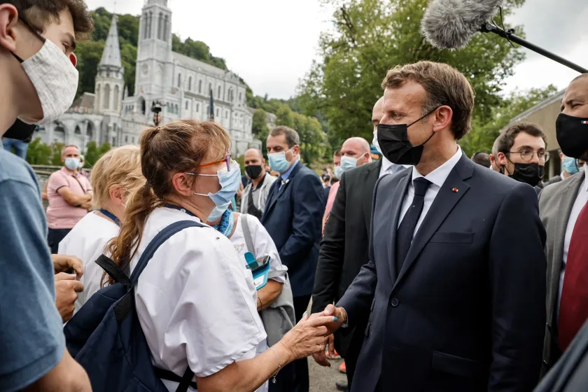French President Emmanuel Macron arrives for a visit at the Catholic sanctuary of Notre Dame de Lourdes, southwestern France, on July 16, 2021. Macron is on a two-day visit in southwestern France, notably to attend stages of the 108th edition of the Tour de France cycling race. 
