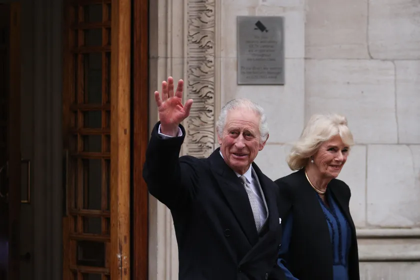 Britain's King Charles III (L) waves as he leaves, with Britain's Queen Camilla, the London Clinic, in London, on January 29, 2024. Britain's King Charles III, 75, stayed the London Clinic following prostate surgery on January 26, 2024. Adrian DENNIS / AFP
