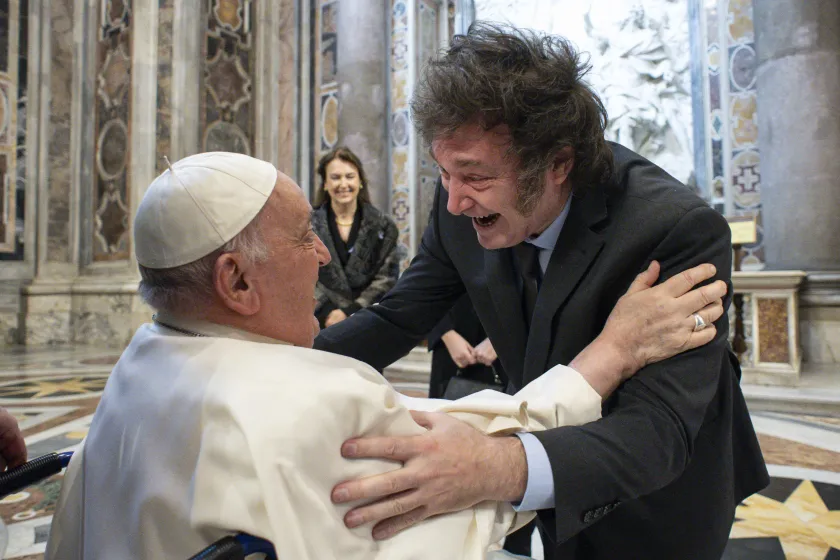 This handout photograph taken on February 11, 2024 and released by the Vatican press office, Vatican Media, shows Pope Francis (L) greeting Argentine President Javier Milei (R) at the Vatican. Handout / VATICAN MEDIA / AFP