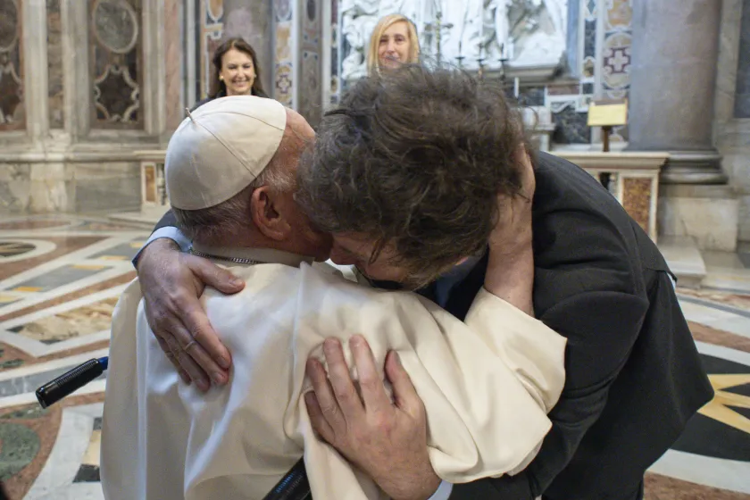 This handout photograph taken on February 11, 2024 and released by the Vatican press office, Vatican Media, shows Pope Francis (L) embracing Argentine President Javier Milei (R) at the Vatican.  Handout / VATICAN MEDIA
