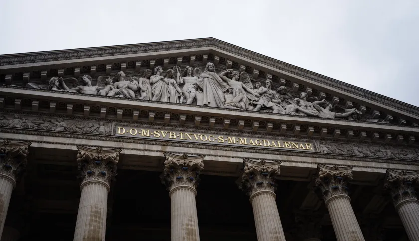 This photograph taken on April 3, 2024, shows a detail of the newly restored facade and entrance of the Sainte-Marie-Madeleine Church, known as La Madeleine in central Paris.  Dimitar DILKOFF / AFP